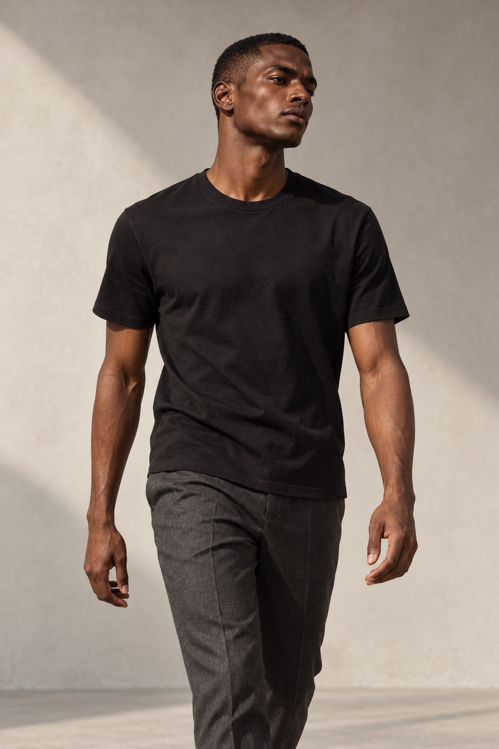 Black crewneck T-shirt campaign concept, model walking