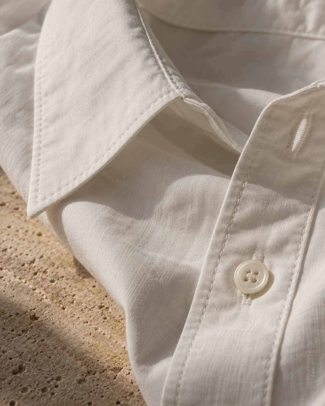 Design study of a cotton shirt collar, button and fine weave