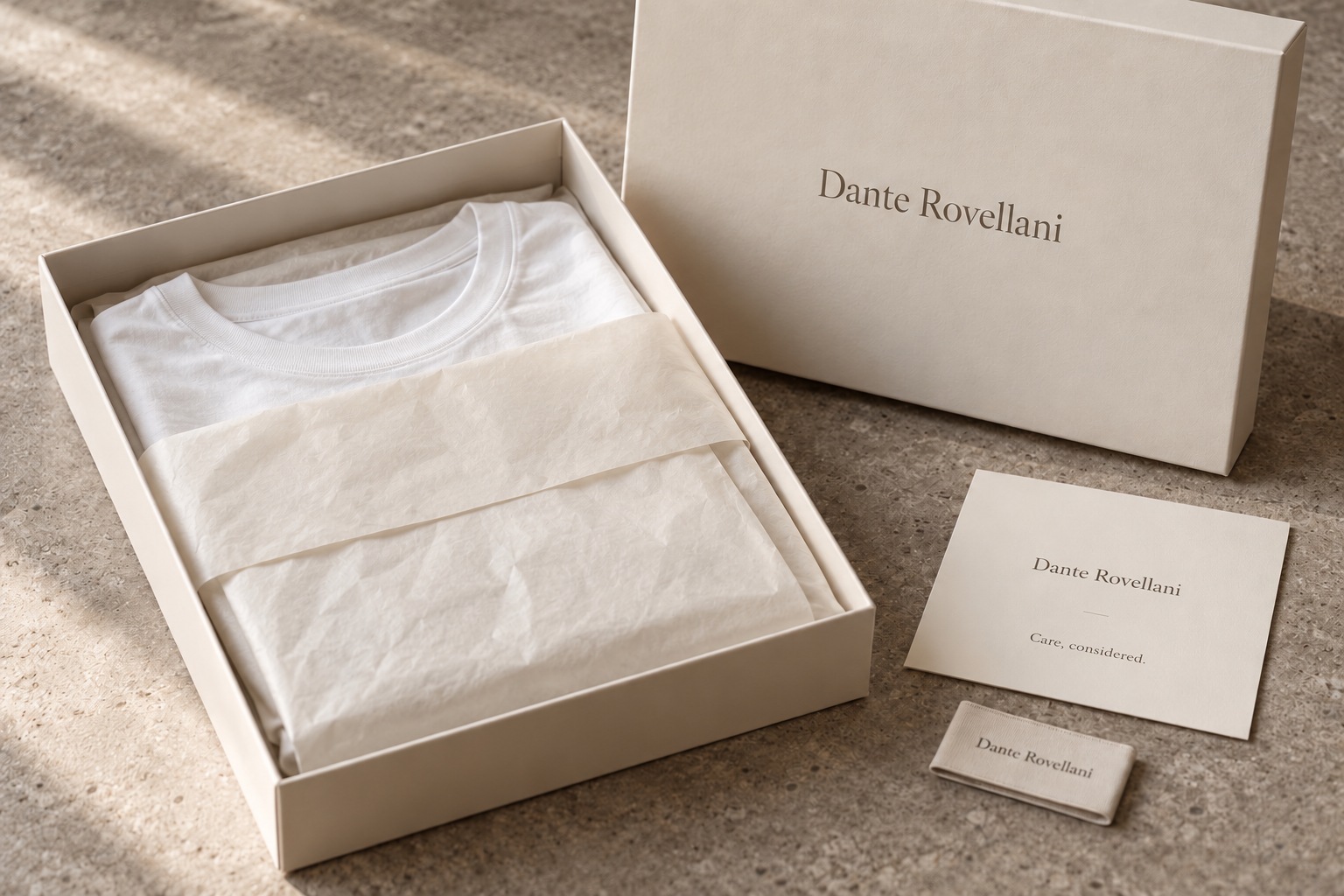 Dante Rovellani packaging design concept with ivory box, tissue, garment label and care card
